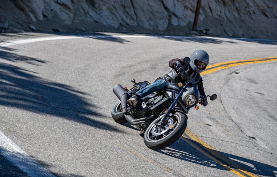 Honda Rebel 1100 leaning into a corner on a mountain road