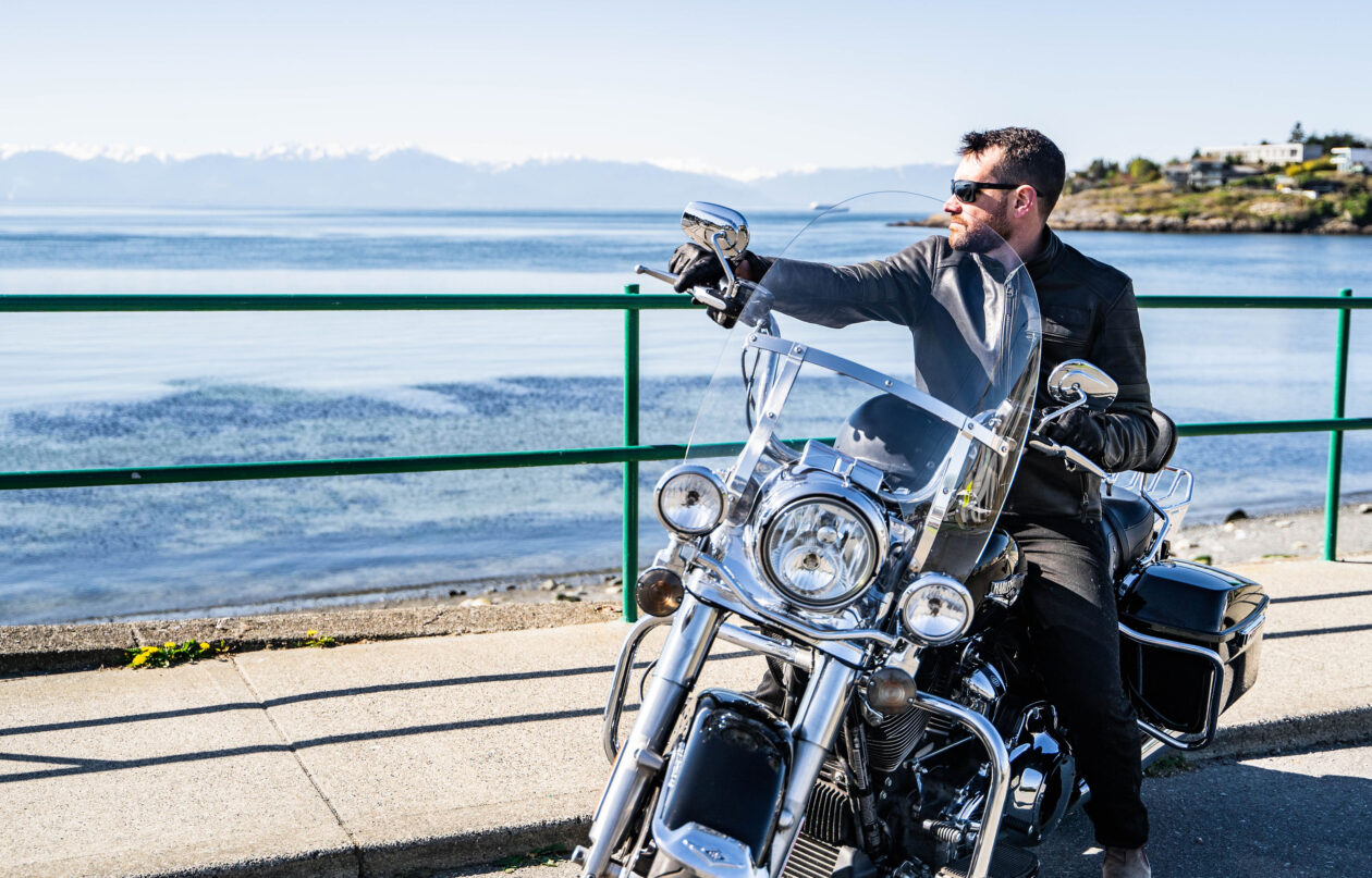 A rider on a Harley-Davidson Road King Looking at the Ocean