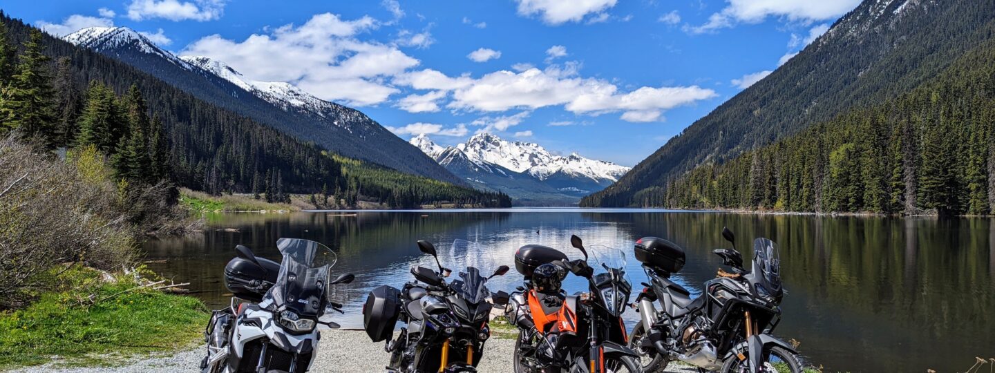 Four motorcycles parked along the duffey lake