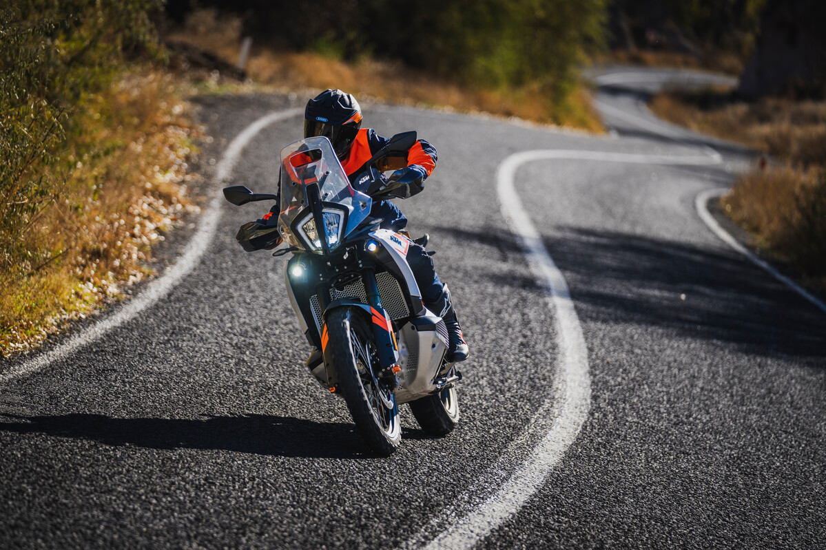 A KTM 790 ADV rider on a twisty road