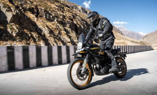 A ridery on a Royal Enfield Himalayn in the mountains