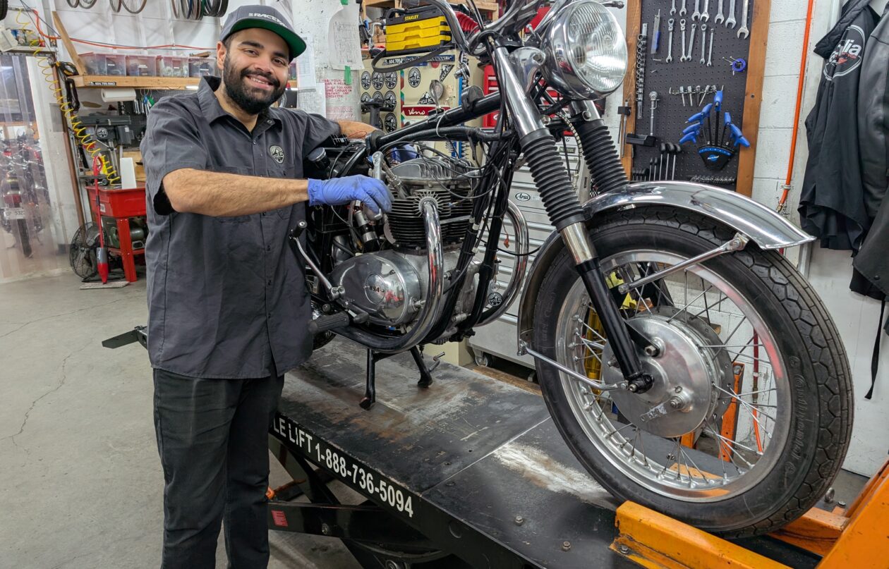 A mechanic working on a motorcycle