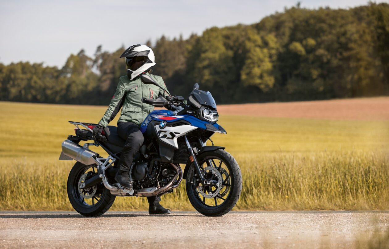 Rider on blue motorcycle in countryside